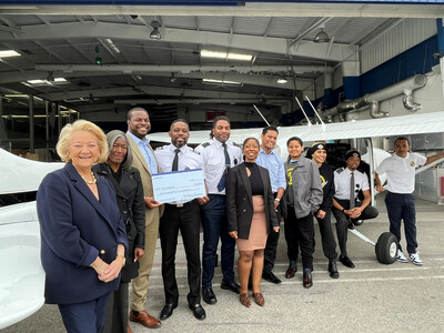 Boeing leaders present a check to Fly Compton. Funds will go toward flight training classes offered to underserved students in LA’s Compton community. (photo: Fly Compton) Boeing leaders present a check to Fly Compton. Funds will go toward flight training classes offered to underserved students in LA’s Compton community. (photo: Fly Compton)