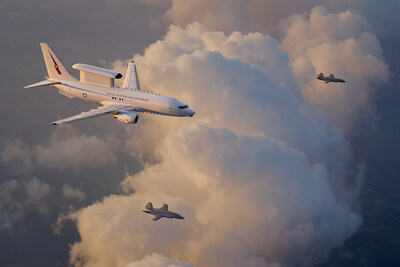 An artist’s rendering of a Royal Australian Air Force E-7A Wedgetail teaming with two MQ-28 Ghost Bat collaborative combat aircraft. (Boeing illustration) An artist’s rendering of a Royal Australian Air Force E-7A Wedgetail teaming with two MQ-28 Ghost Bat collaborative combat aircraft. (Boeing illustration)